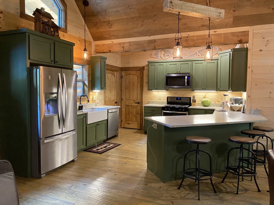 The kitchen is fully stocked with all new appliances and utensils. 
