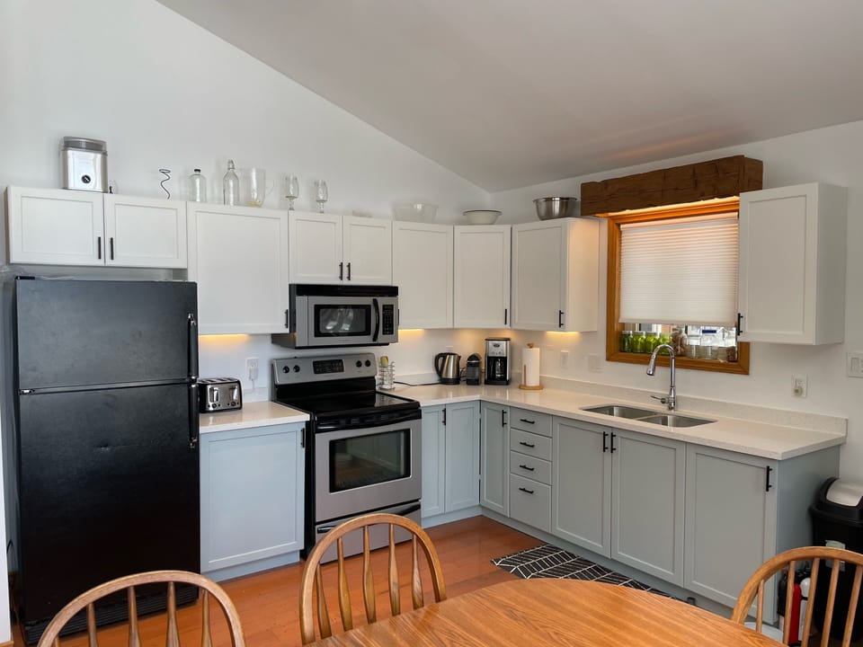 Fully stocked kitchen with nespresso machine and pods 