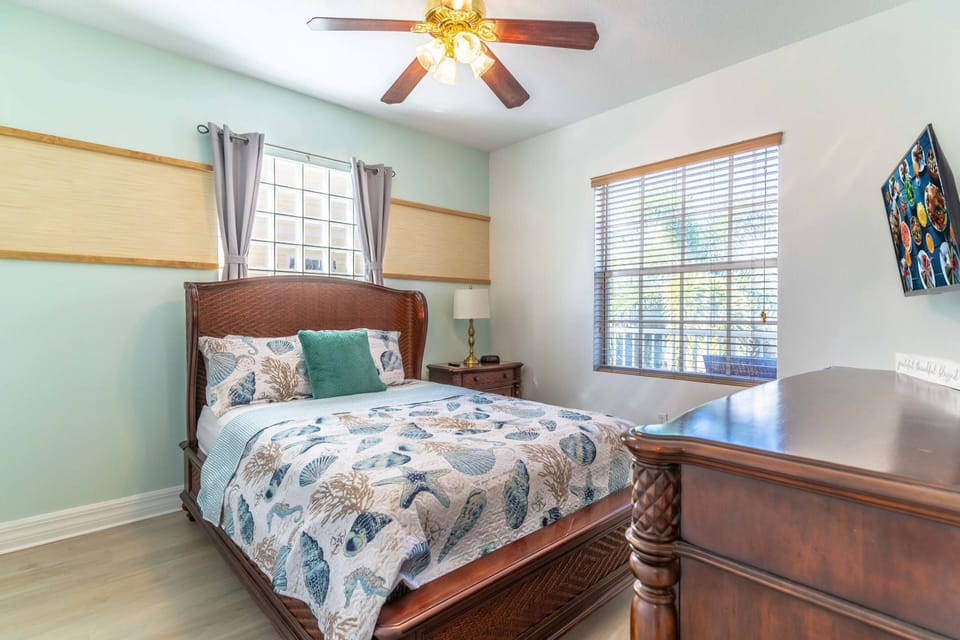 Main Floor Queen Bedroom w/ Flat Screen TV and Streetside View