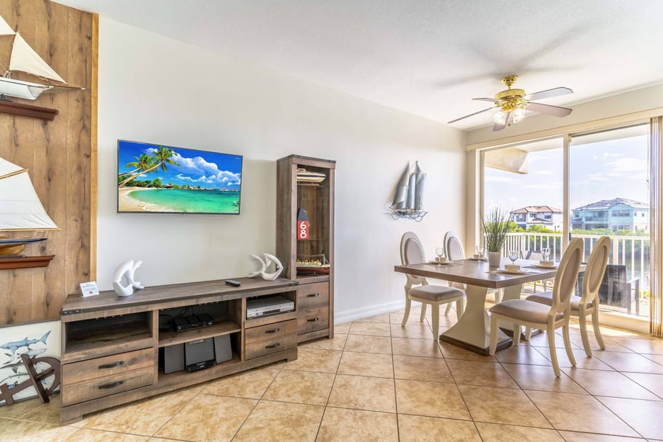 Unique Wall Décor and Large Flat Screen TV in Living Area