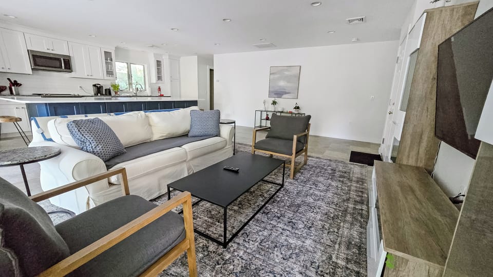 Living room with comfortable furniture and large flat screen TV