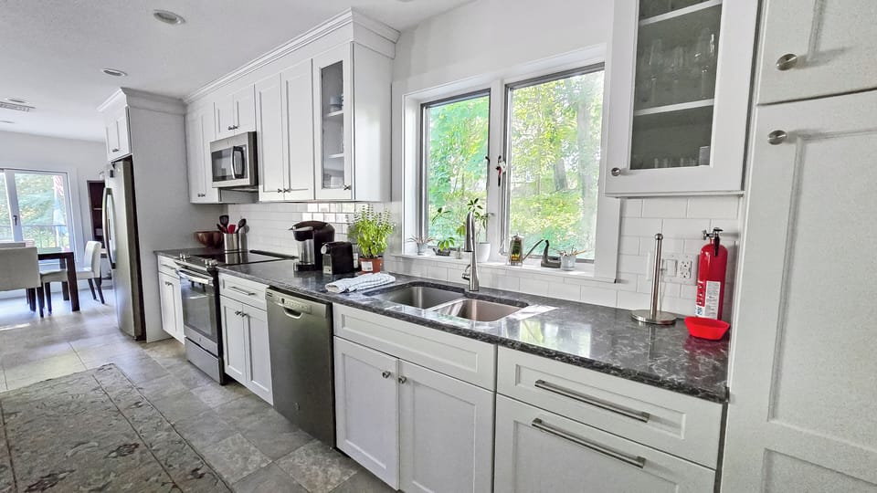 Nicely equipped kitchen with stainless appliances