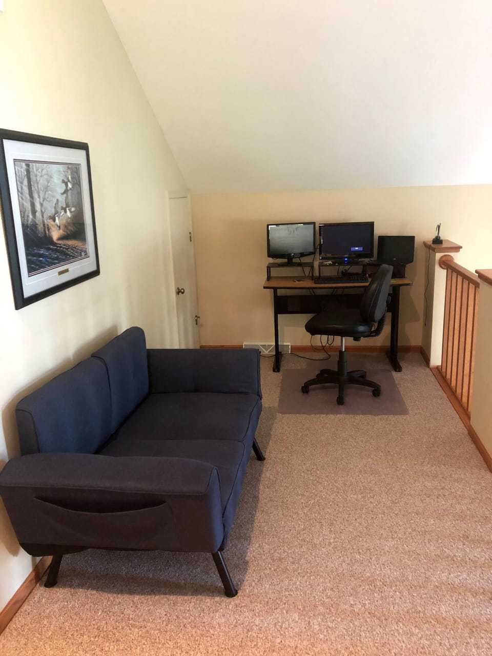 Landing at top of the stairs - futon and “office”