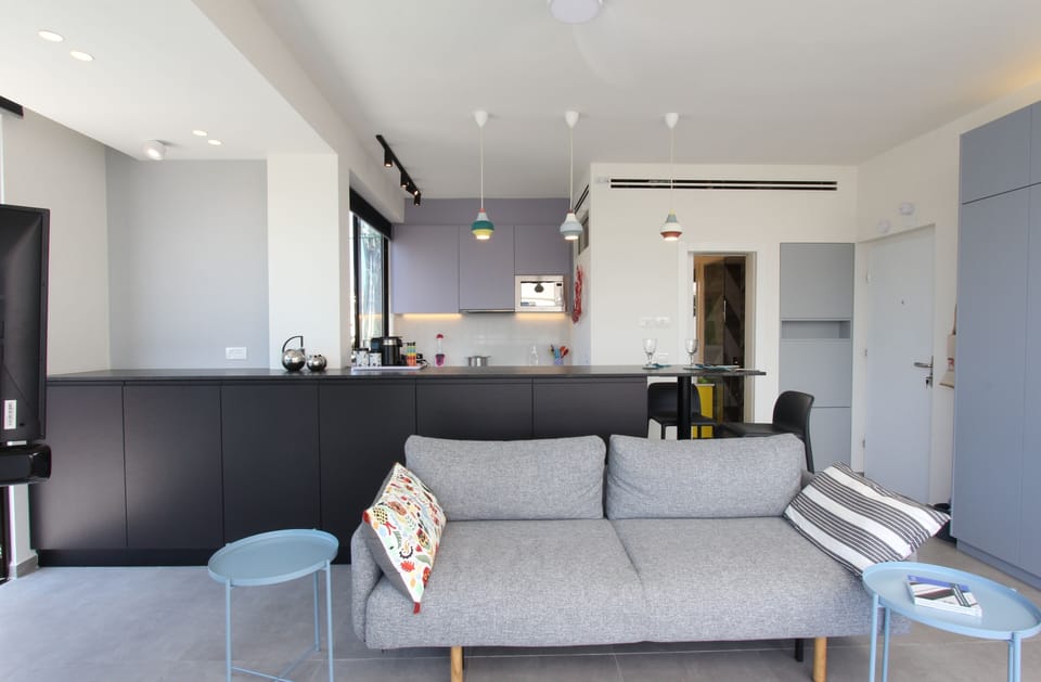 Open-plan living area with fully equipped kitchen 