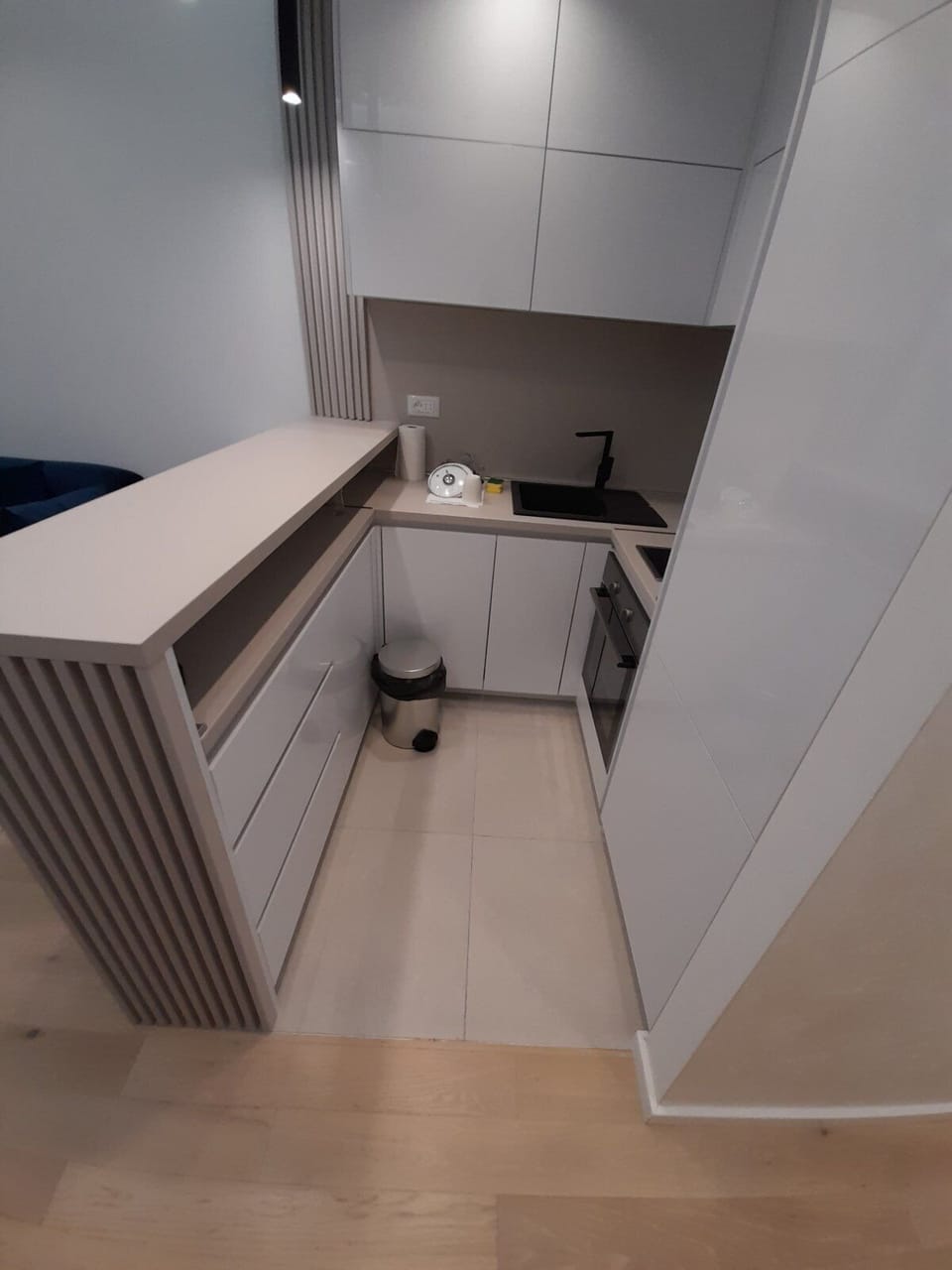 Kitchen shares space with the dining table with chairs