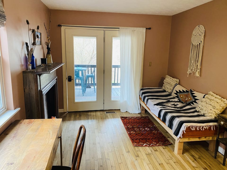 Main bedroom french doors lead to deck with a view of the play area and barn. 