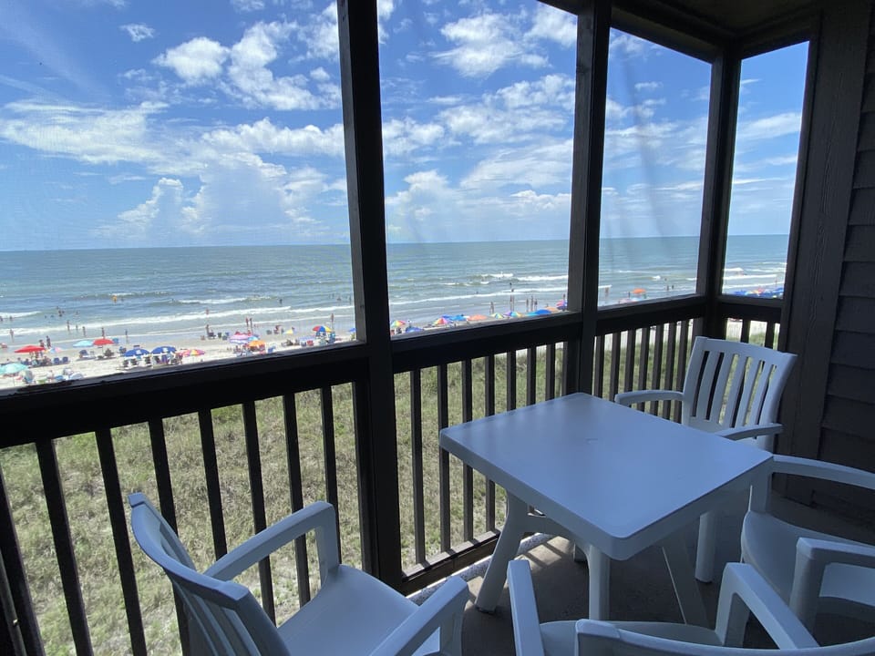 Oceanfront screen porch with views north and south.