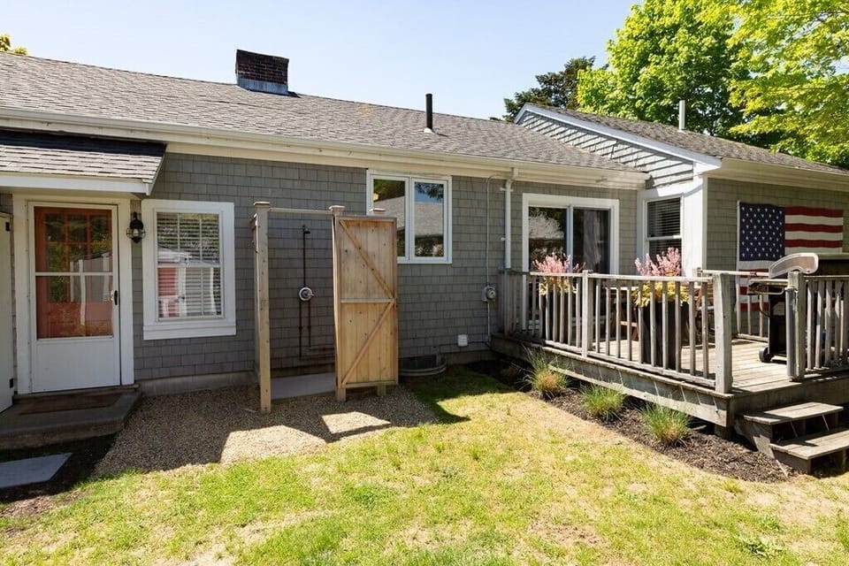 Backyard with deck and outdoor shower