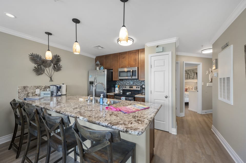 Kitchen with granite and stainless appliances