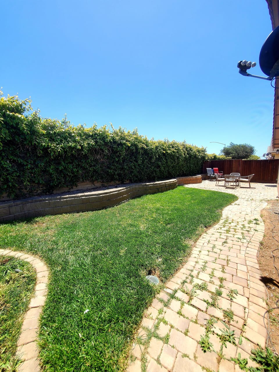 Backyard with two patios sets. 