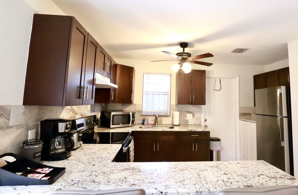 Fully equipped kitchen with stainless steel appliances. 