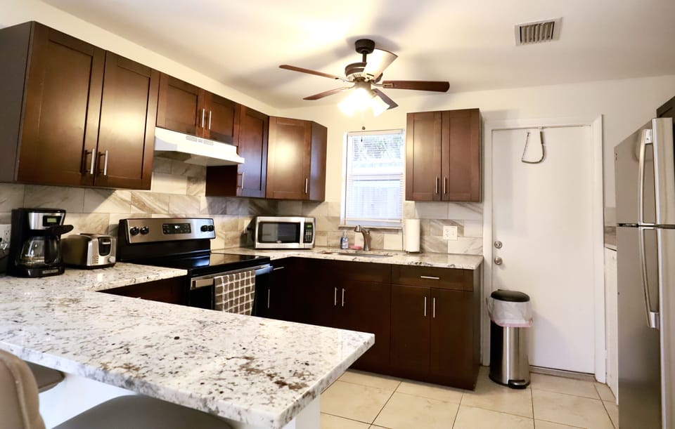 Fully equipped kitchen with stainless steel appliances. 