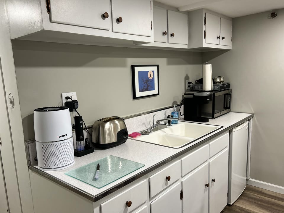 The space has a kitchenette (with mini fridge) for simple meal preparation.