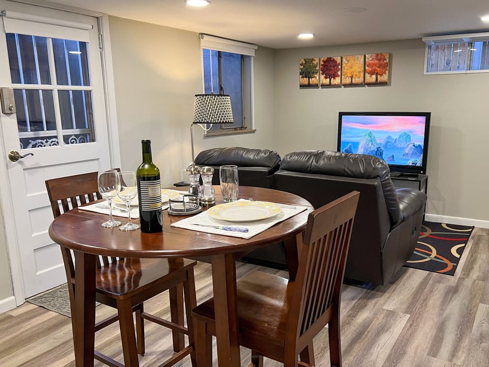 The dining table's leaves will be down when you arrive but can be raised.