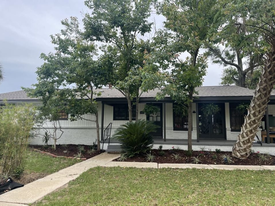 Street view - 3 bed/2 ba. mid-century home right on the water!!