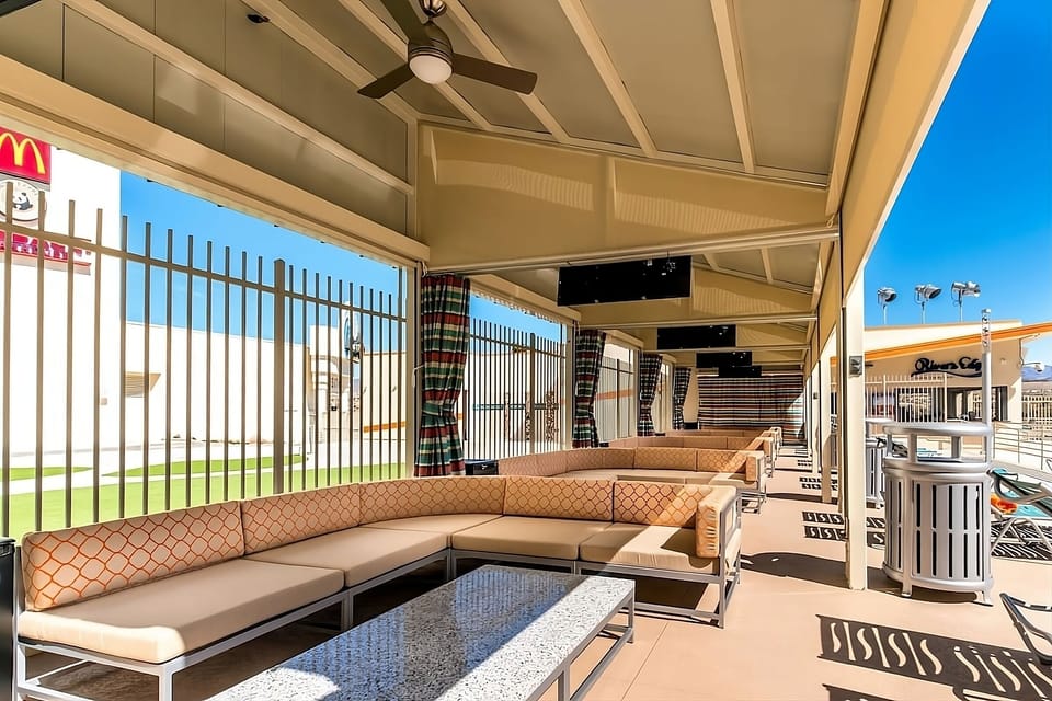 Unwind on shaded patio seating with bright, breezy comfort.