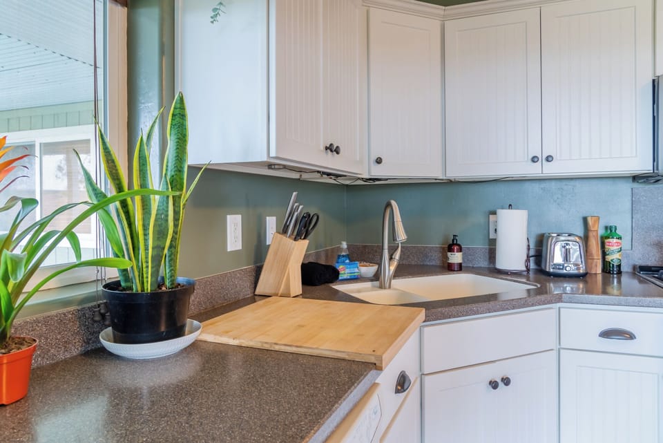 Gather around the sink and prep on the wide wood board