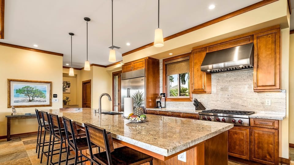 kitchen is equipped with Subzero, Wolf, and Bosch appliances