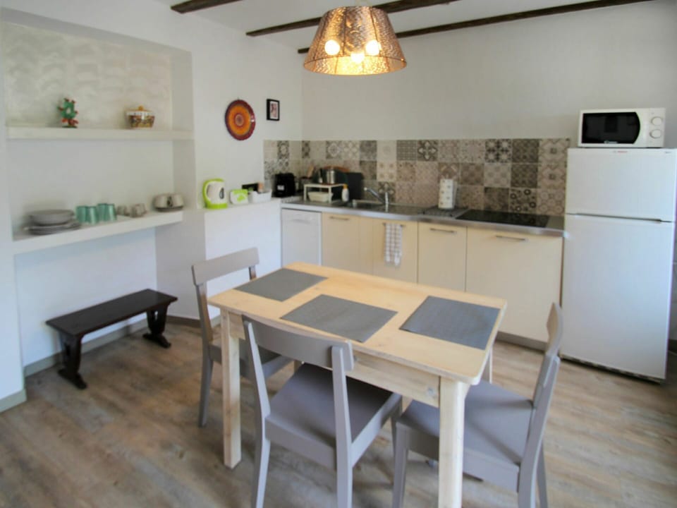 Table, Furniture, Cabinetry, Countertop, Picture Frame, Building, Wood, Interior Design, Lighting, House