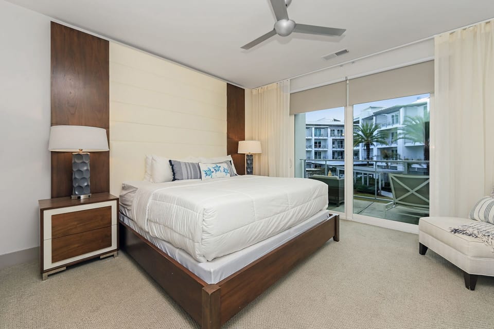 Master bedroom suite w/ private balcony access & outdoor seating