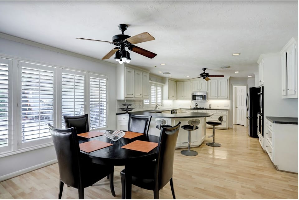 Spatious, open kitchen with microwave, lots of seating and counter space.