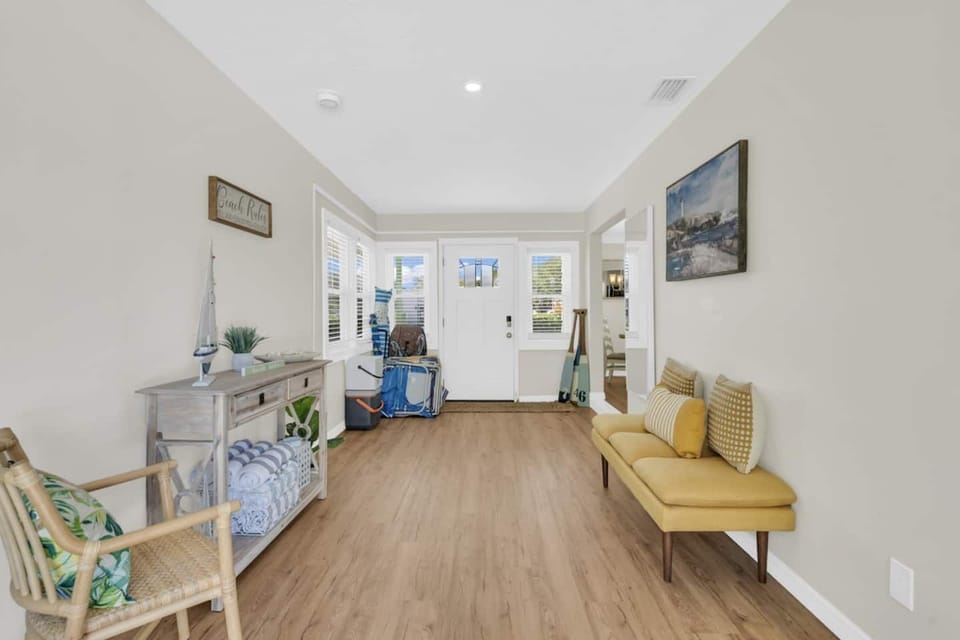 Front Hallway with Beach Chairs, Toys and Supplies