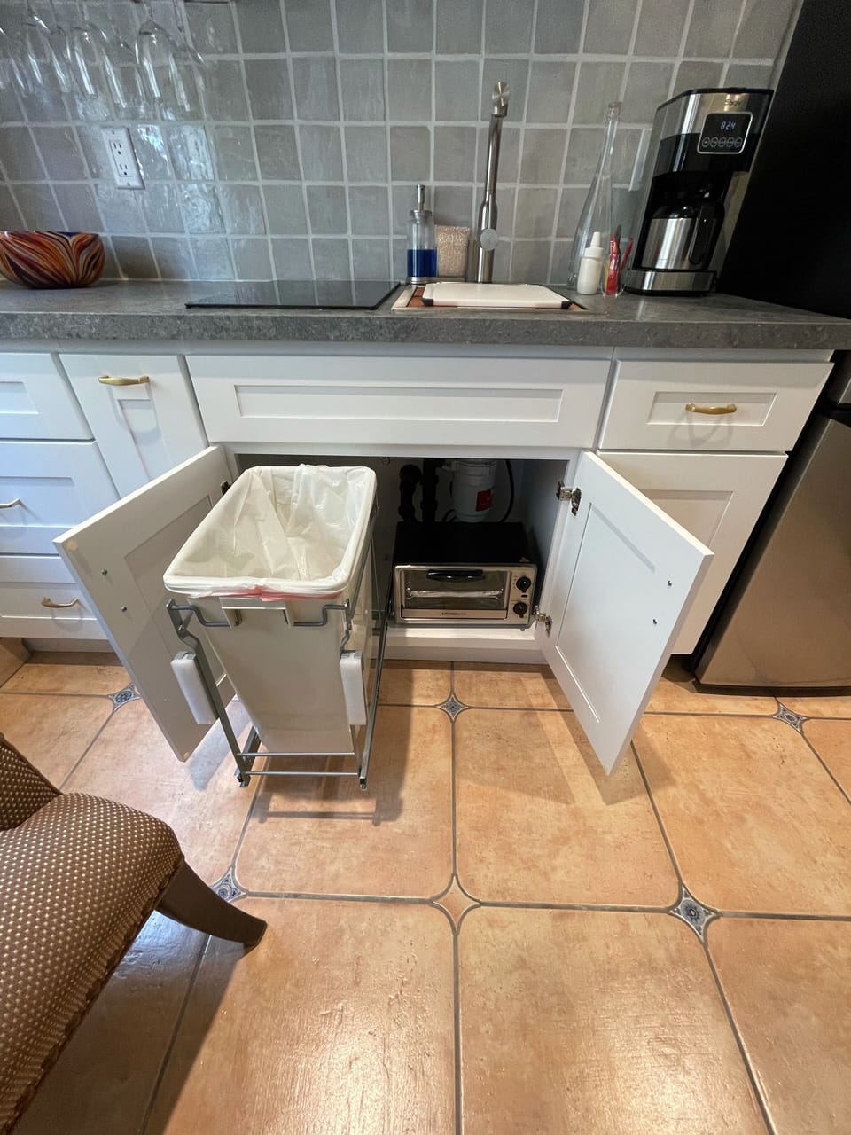 Trash can, toaster, coffee maker