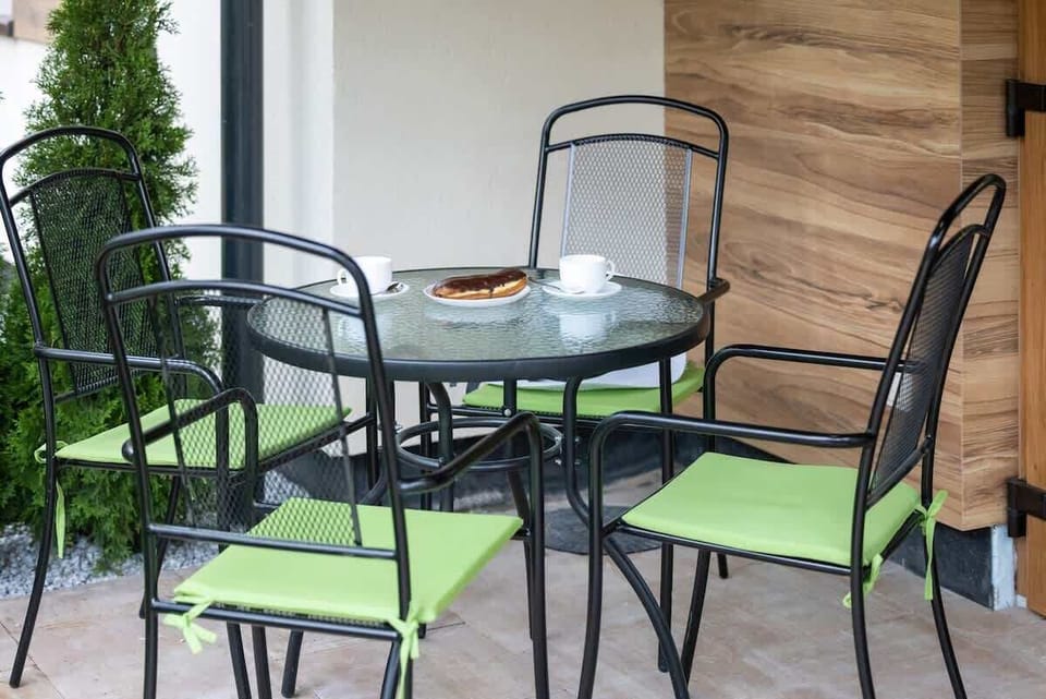 Terrace/patio with garden furniture.