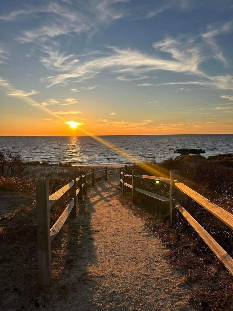Follow this golden, sun-drenched path directly to the water's edge. This scenic walkway through the dunes offers front-row seats to spectacular bay sunsets, making every evening of your vacation feel truly magical.