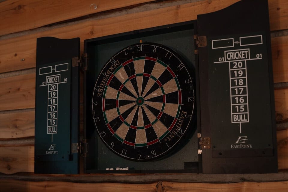 Dartboard Fun - Hit the bullseye in our games room for some friendly competition!