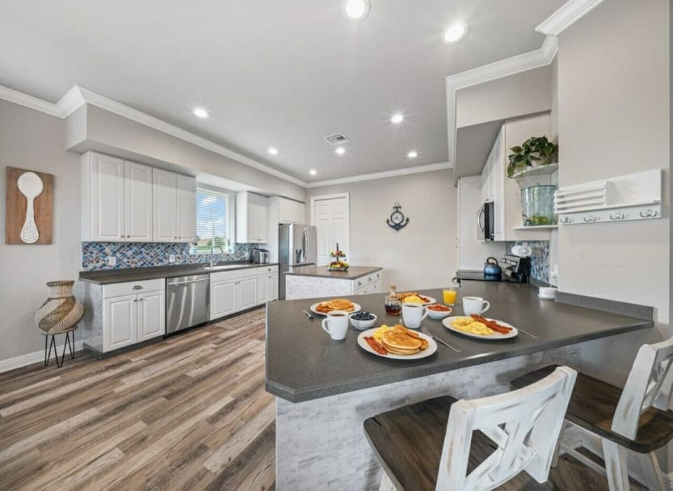 Fully equipped, bright kitchen perfect for shared breakfasts and easy family meals before a day on the island.