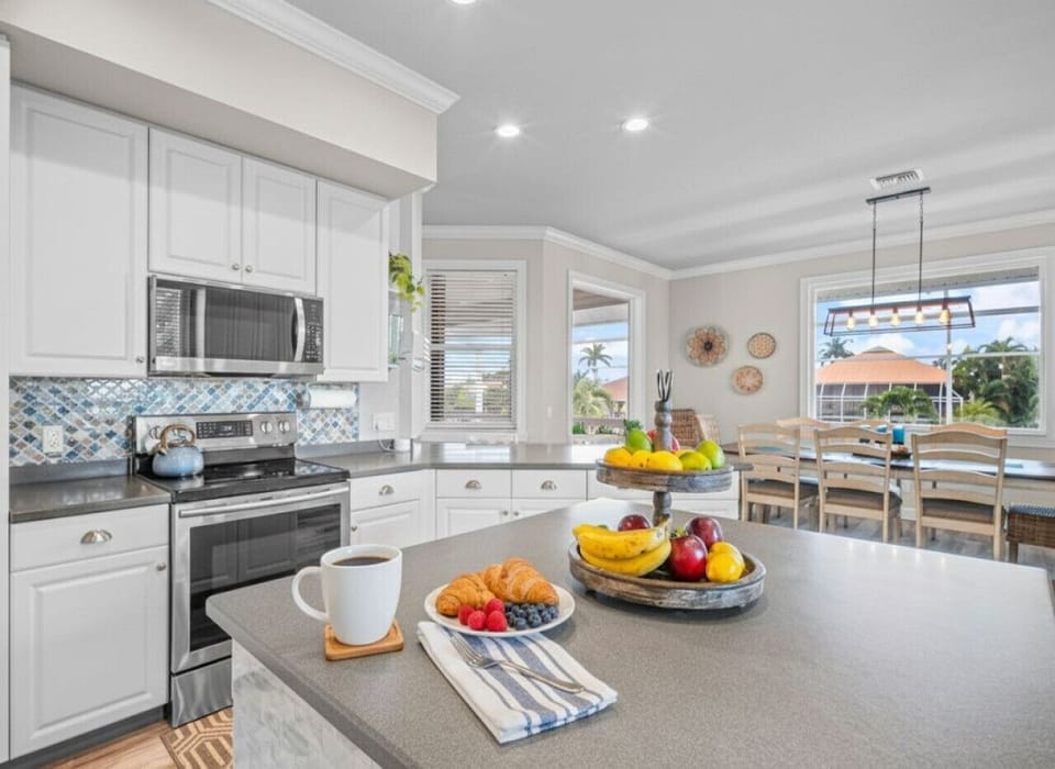 Bright, open kitchen and dining area ideal for slow mornings and shared meals with island views.