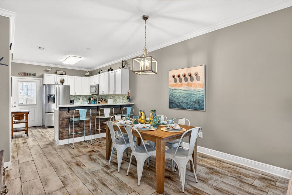 The brand new dining table makes coastal dining effortless and beautiful! Plenty of room for 6 at the table and 3 at the breakfast bar