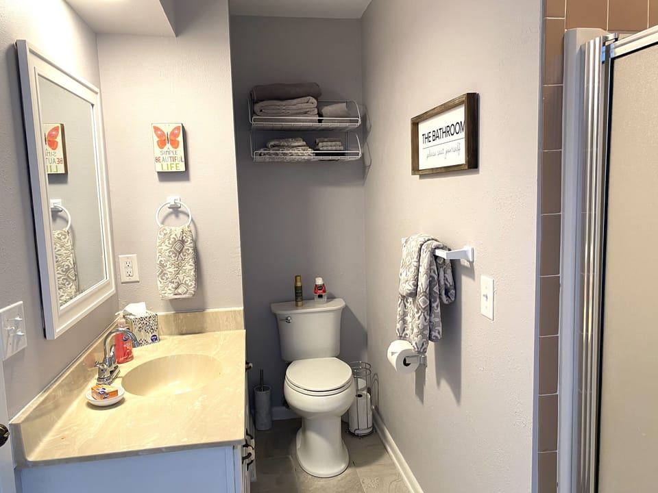 Hall bathroom, also opens into spare bedroom