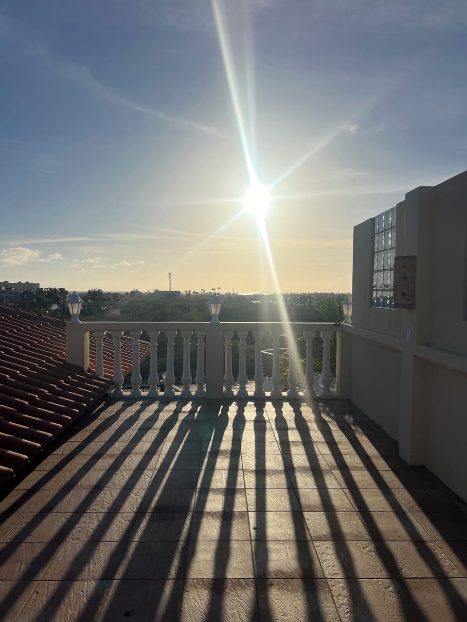 View of the sun getting ready to set from the upper patio