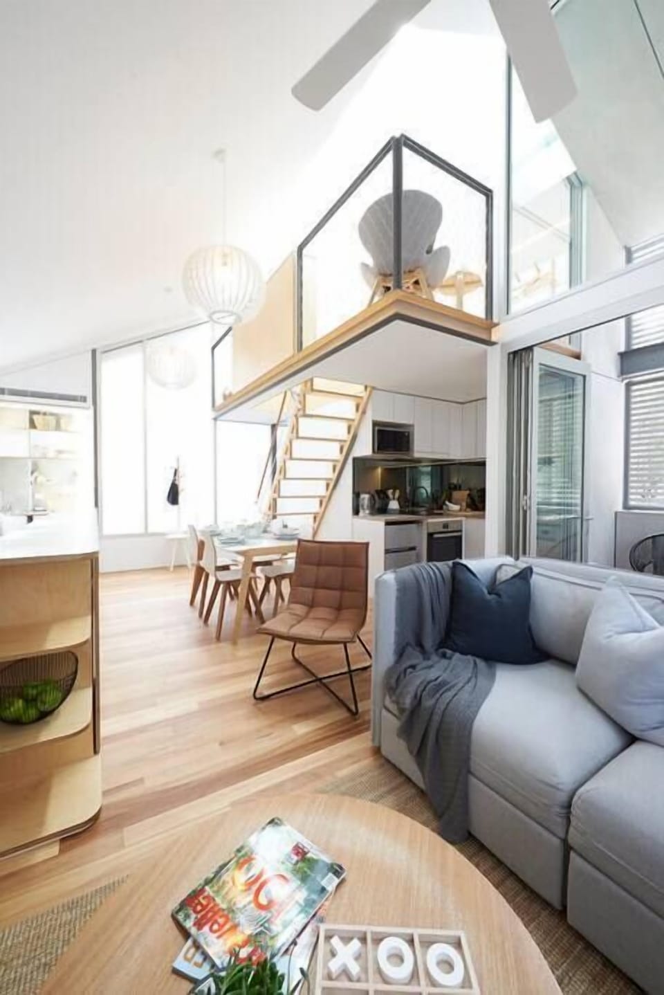 Living area with an upstairs bedroom view. 