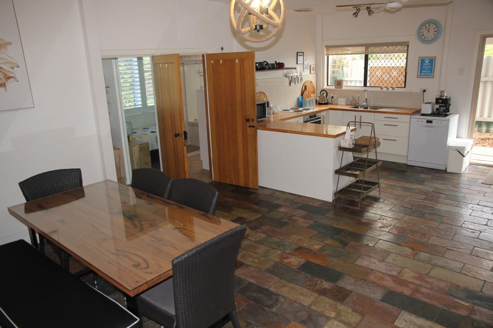 Two bedrooms and bathroom are off the main living space
