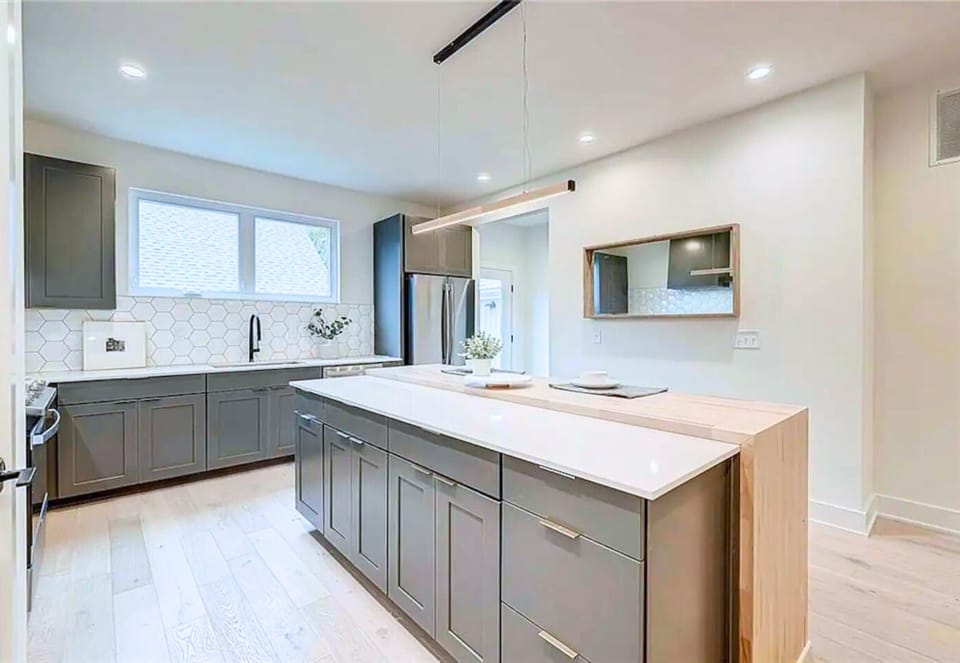 Spacious and Fully Stocked Kitchen with Modern Amenities