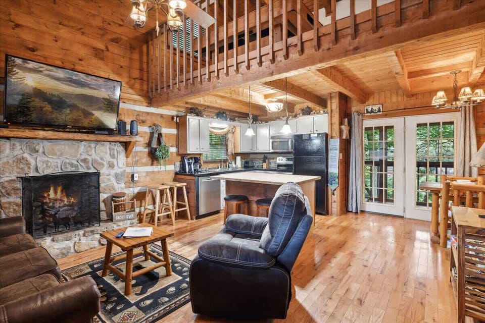 Experience mountain charm with a stone fireplace and a view of nature's splendor!