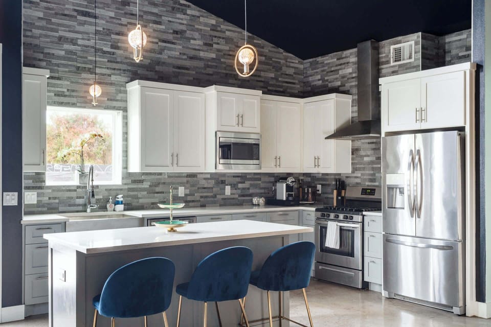 Fully equipped kitchen with large kitchen island and bar seating