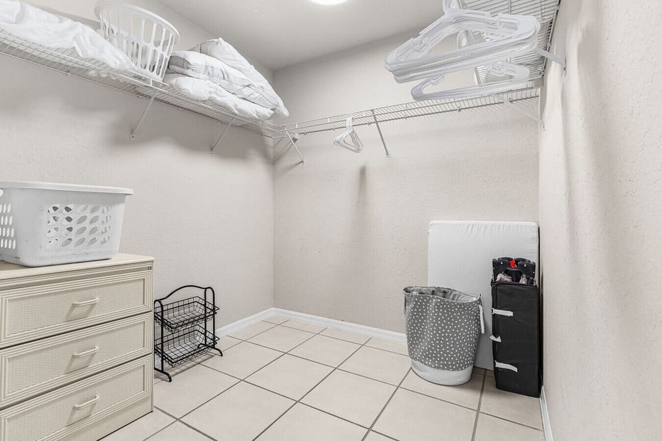This primary closet holds a pack and play and tons of room