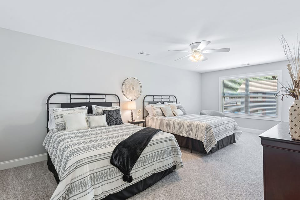 one of 2 oversized beds upstairs.  Sitting chairs have been added to this room.