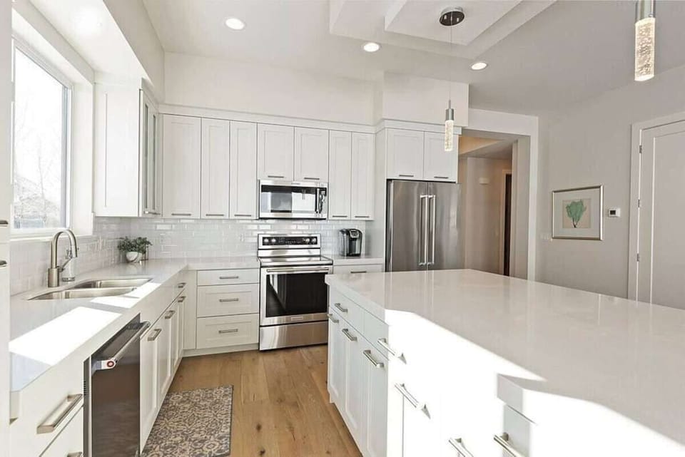 Prepare meals with ease using the provided coffee maker, double sink, and a selection of kitchen utensils, ensuring a seamless cooking experience during your stay.