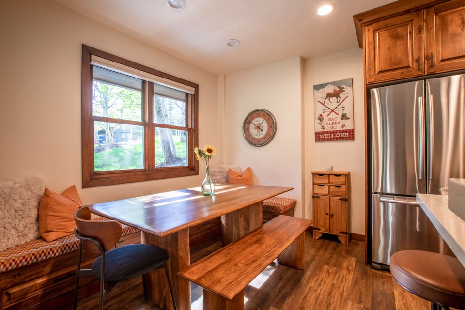 Cozy dining table with bench seating.