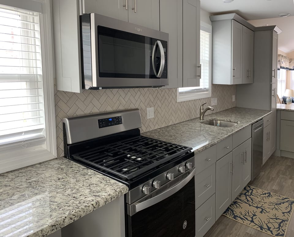 Five burner stove, microwave, dishwasher and garbage disposal!