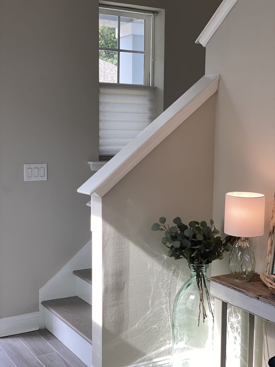 Stairs to loft, office area and two guest bedrooms with full bathroom