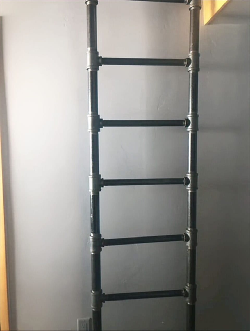 Cutest ladder ever going up to the loft bed.