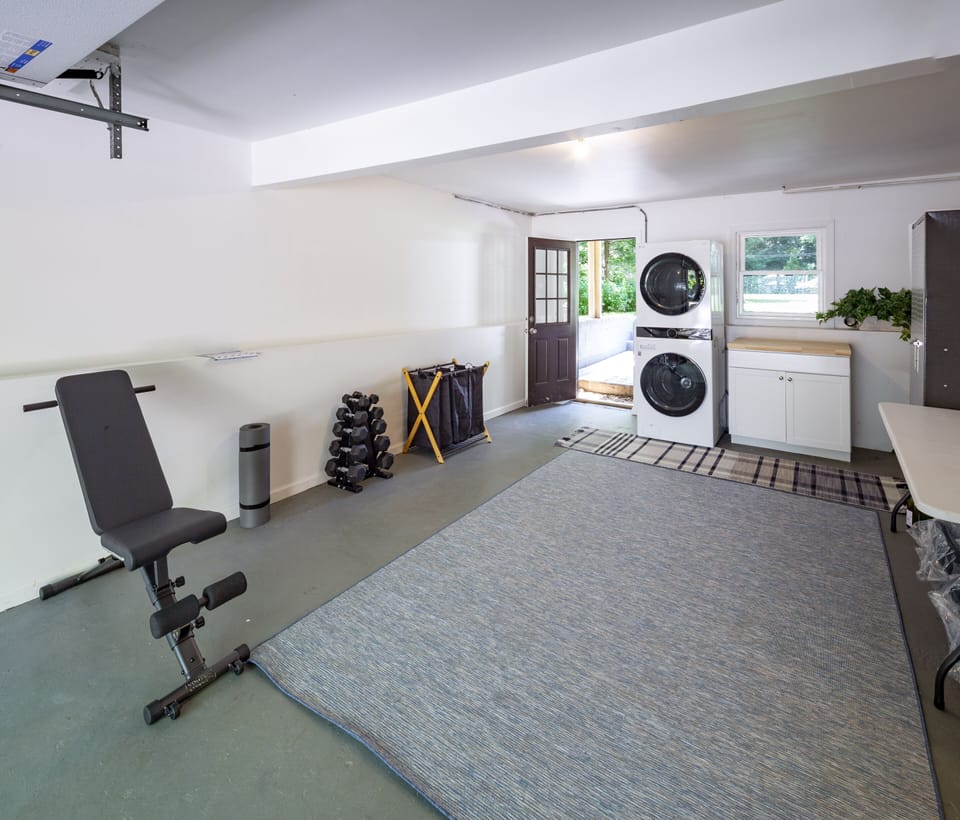Work out Area with Laundry Area in Garage Area. 