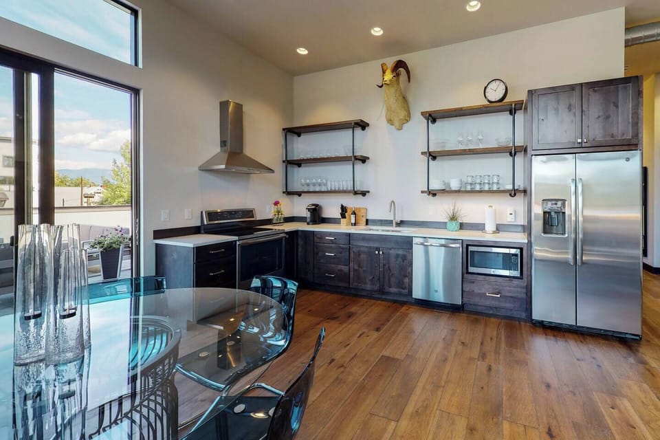 Access to the private rooftop deck from the main living area. 