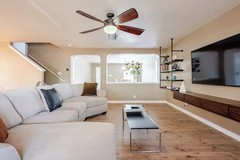 Spacious Living room with 65'' TV, perfect for enjoying your favorite game/show.